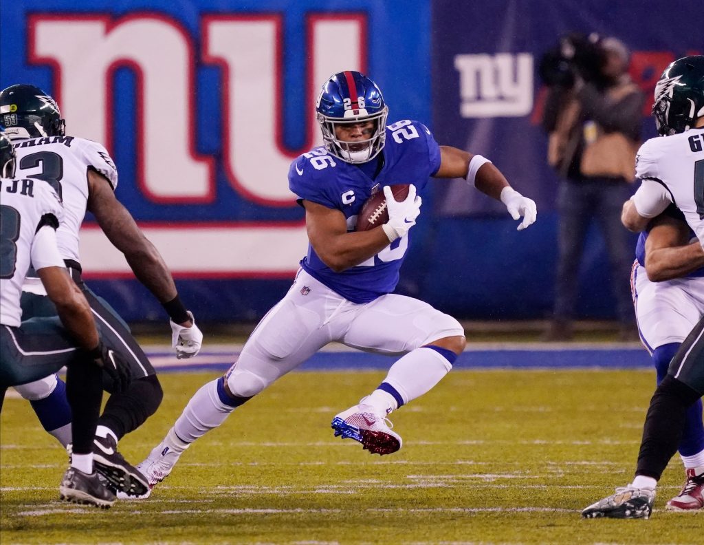 New York Giants running back Saquon Barkley runs up the field.