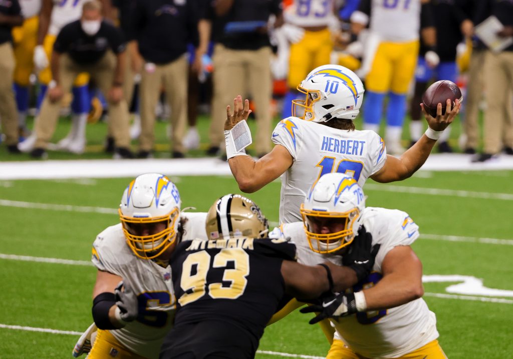 Justin Herbert attempts a pass during the Los Angeles Chargers' Monday Night Football loss to the New Orleans Saints