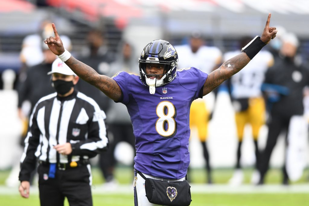 Baltimore Ravens quarterback Lamar Jackson (8) celebrates after a touchdown against the Pittsburgh Steelers