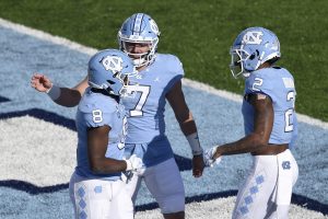 North Carolina quarterback Sam Howell celebrates with teammates after touchdown in game against Western Carolina