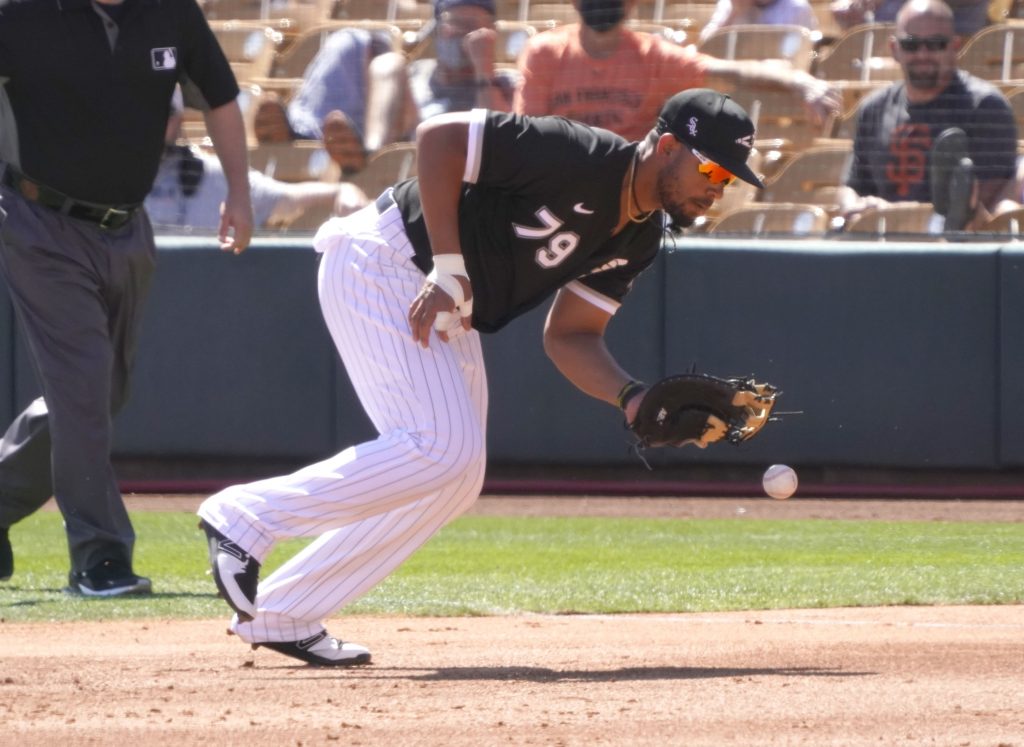 Chicago White Sox first baseman Jose Abreu (79) makes the play for an out against the San Francisco Giants during a spring training game at Camelback Ranch