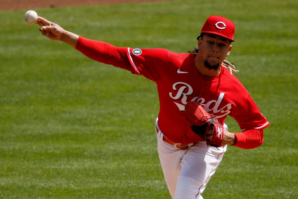 Cincinnati Reds starting pitcher Luis Castillo (58) throws a pitch in the third inning of the MLB National League game between the Cincinnati Reds and the Pittsburgh Pirates at Great American Ball Park in downtown Cincinnati on Wednesday, April 7, 2021