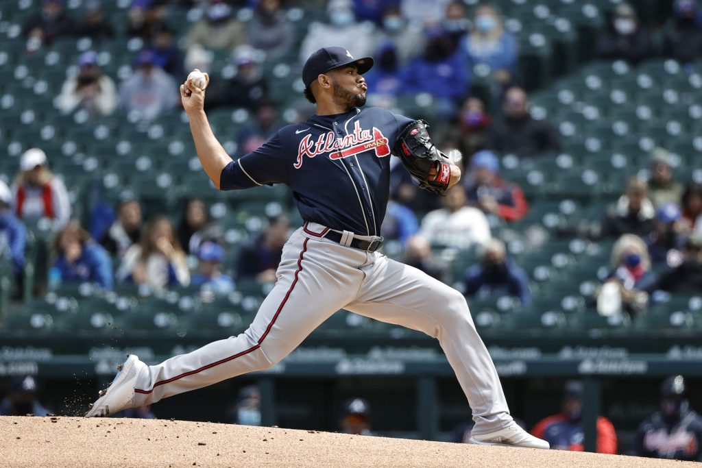 Atlanta Braves starting pitcher Huascar Ynoa (19) delivers against the Chicago Cubs during the first inning at Wrigley Field.