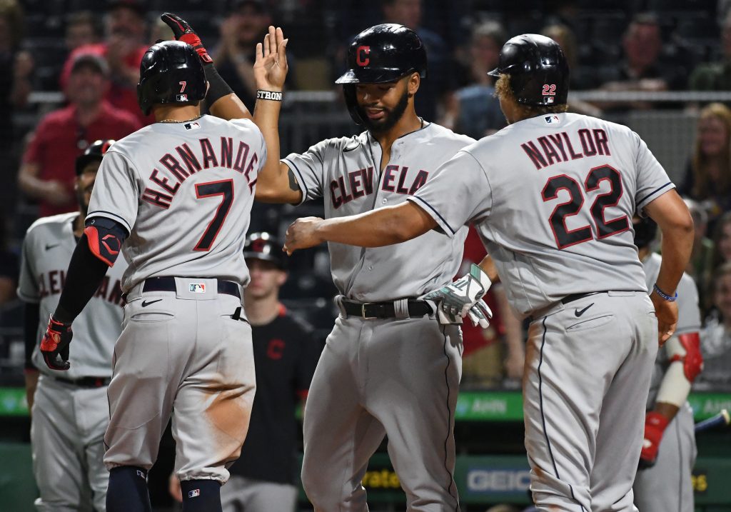 Cleveland Indians batter Cesar Hernandez (7) is greeted at home after hitting a grand slam in the seventh inning against the Pittsburgh Pirates at PNC Park.