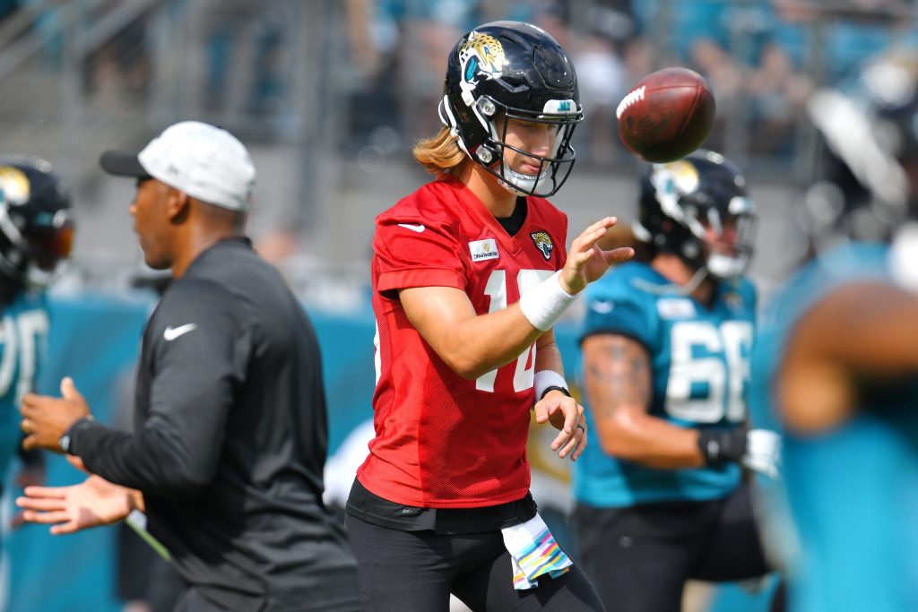 Jaguars quarterback (16) Trevor Lawrence flips the ball away during drills Sunday's scrimmage session public money