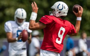 Indianapolis Colts quarterback Jacob Eason (9) drops back to pass Friday, Aug. 13, 2021, during a joint practice with the Carolina Panthers
