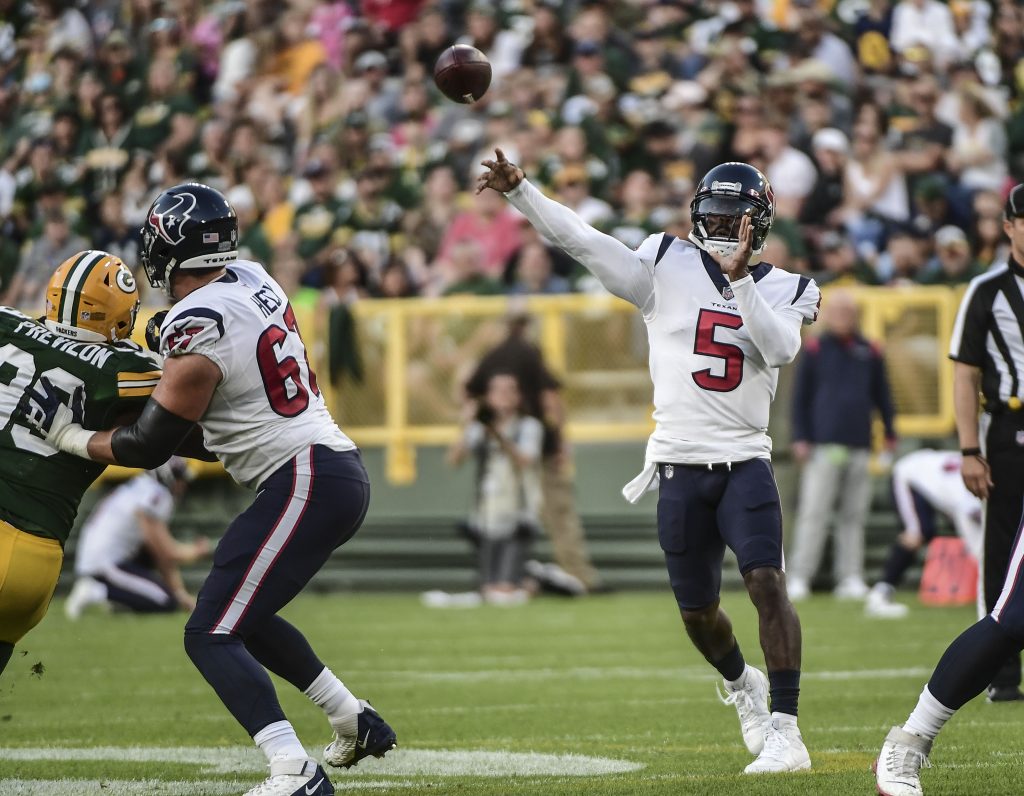 Houston Texans quarterback Tyrod Taylor (5) throws a pass against the Green Bay Packers in the first quarter during the game at Lambeau Field preseason