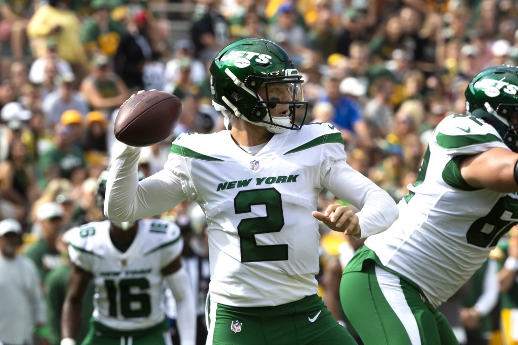 New York Jets quarterback Zach Wilson (2) drops back to pass in the first half against Green Bay Packers during a preseason game at Lambeau Field Week 1