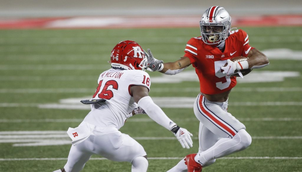 Garrett Wilson (5) teams with Chris Olave to give Ohio State one of the nation's best receiving duos. Ohio State Buckeyes Football Faces The Rutgers Scarlet Knights