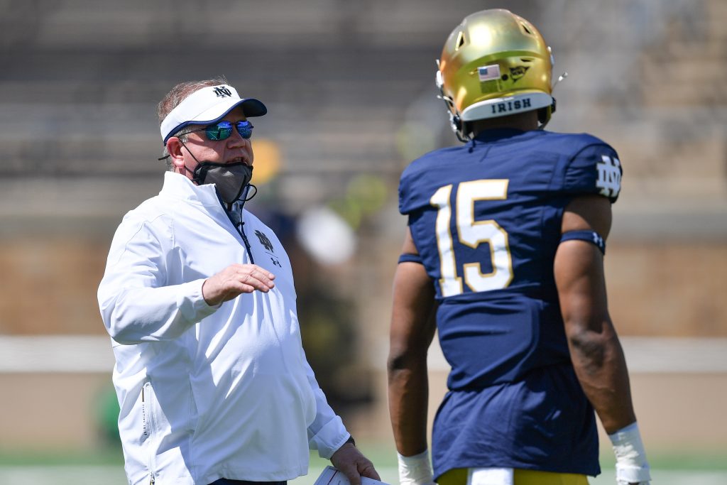 Notre Dame Fighting Irish head coach Brian Kelly talks to wide receiver Jordan Johnson (15) in the first half of the Blue-Gold Game at Notre Dame Stadium.