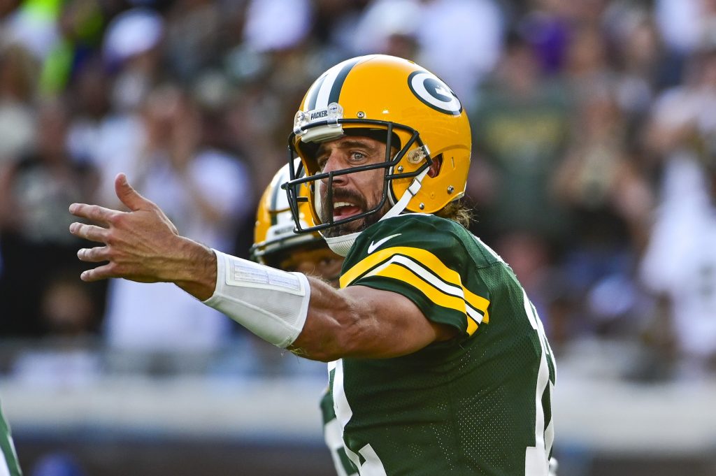 Green Bay Packers quarterback Aaron Rodgers (12) directs teammates during the second half against the New Orleans Saints at TIAA Bank Field.
