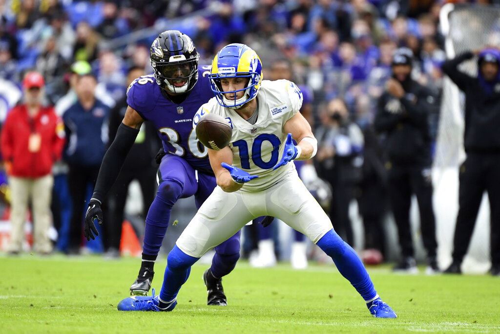 FILE - Los Angeles Rams wide receiver Cooper Kupp (10) attempts to catch the ball against Baltimore Ravens safety Chuck Clark (36) during the first half of an NFL football game, on Jan. 2, 2022, in Baltimore. Five players, including dynamic pass catchers Cooper Kupp and Davante Adams, are unanimous choices for The Associated Press 2021 NFL All-Pro Team, announced Friday, Jan. 14, 2022.