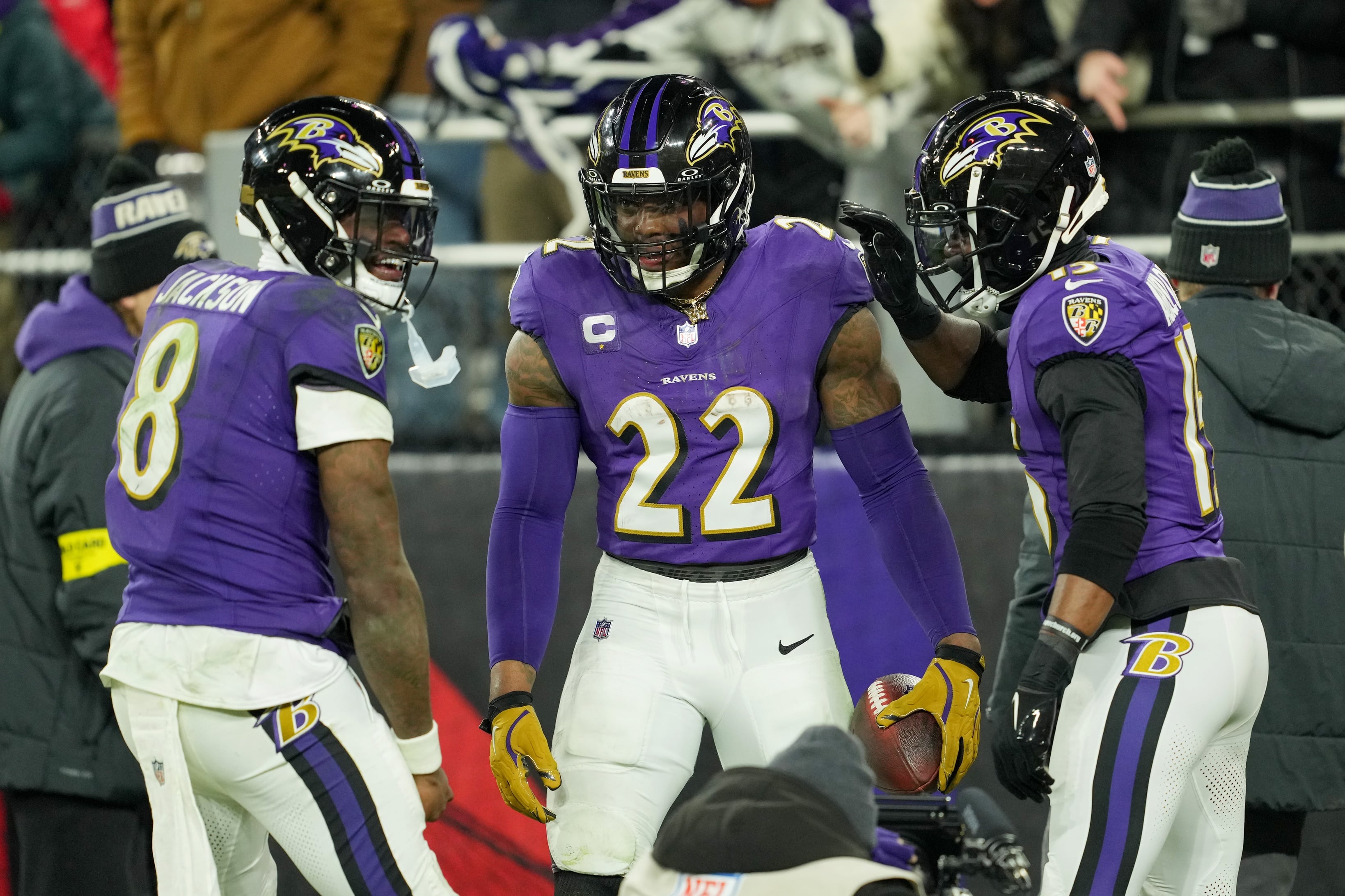 Baltimore Ravens running back Derrick Henry (22) celebrates with wide receiver Nelson Agholor (15) and quarterback Lamar Jackson (8) after scoring a touchdown against the Pittsburgh Steelers.